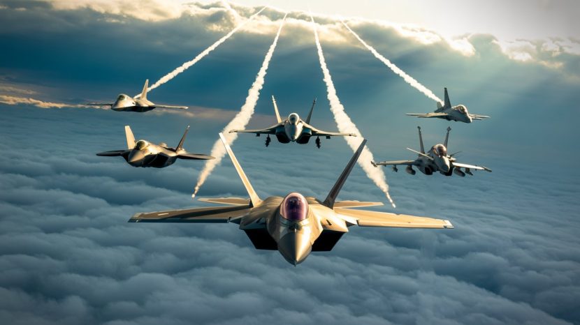 Top 10 Air Superiority Fighter Jets World 2025 Air superiority fighter jets flying above the clouds with visible contrails, showcasing modern military aviation power under a dramatic sky.
